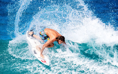Matt Wilkinson surfing